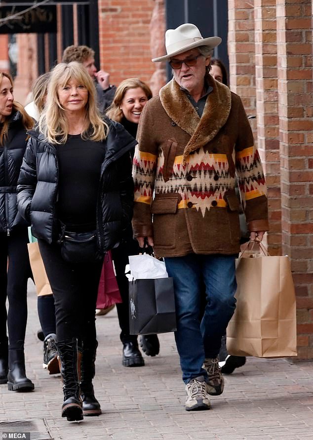 The couple appeared to be doing some last-minute Christmas shopping as Russell, 73, was seen carrying large paper shopping bags. Goldie put on a stylish display in an all-black outfit with a cozy puffer jacket, long-sleeved top and comfortable leggings