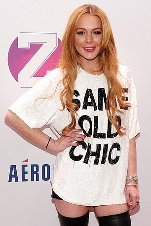 Lindsay Lohan, 38, showcased her unrecognizable new face this year - prompting speculation that she had a $300k plastic surgery glow-up; seen in 2013