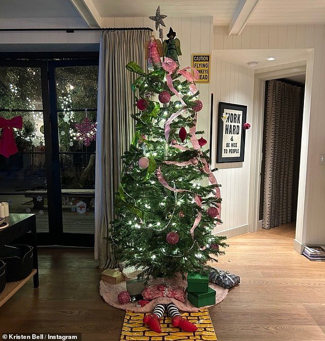 Kristen Bell opted for a Wicked-themed Christmas tree - she even had a Yellow Brick Road laid on the ground and the Wicked Witch Of The East's legs protruding from under the display