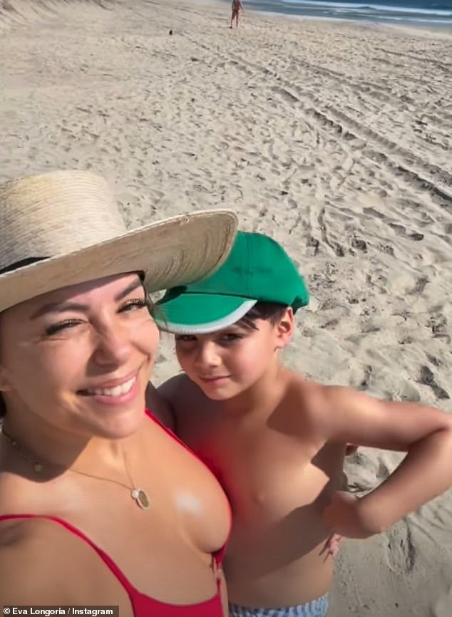 In the clips shared to her Instagram Story, Eva carried Santiago in her arms as they walked across the beach and The Desperate Housewives star looked gorgeous as she shielded her eyes with a wide-brimmed cream ha