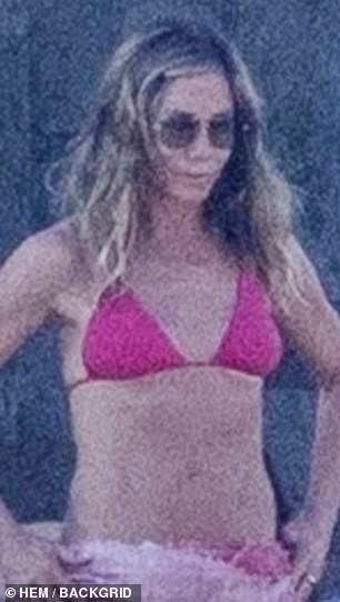 Jennifer Aniston, 55, recycles skimpy string bikini look for latest star-studded vacation