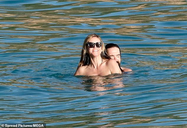 Heidi couldn't stop smiling as they stayed close in the water