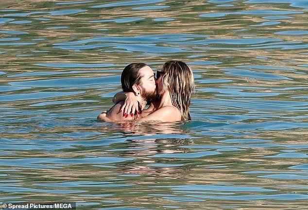 The couple enjoyed a steamy PDA session in the ocean, as well as sharing hugs and staying close