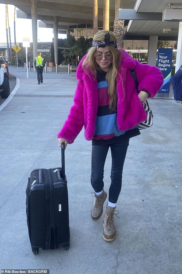 Manning — who starred as Tiffany 'Pennsatucky' Doggett in the hit Netflix series — donned a hot pink teddy coat over patterned top, black leggings, and a pair of dotted beige lace-up boots