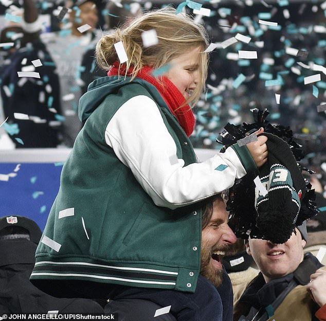 When confetti rained down on the field during the Eagles' home game win, Cooper put his daughter up on his shoulders