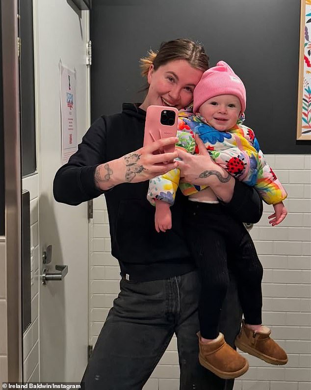 Also missing from The Baldwins preview was Alec's Oregon-based eldest daughter Ireland, who welcomed her 20-month-old daughter Holland with Grammy winner RAC (pictured January 14)