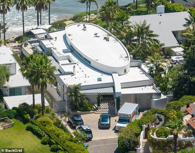 Moving vans were seen outside of Costner's $145million home in Carpinteria, California in July 2023 as Baumgartner moved out of their home