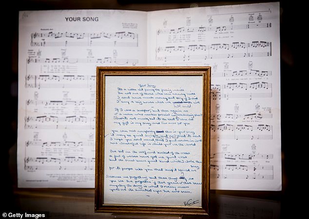 The original handwritten lyrics written by Bernie Taupin to Your Song by Elton John are pictured on display at Bonhams on October 10, 2018 in London, England