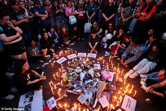 Fans of Payne gather around candles in front of the Obelisk on October 17, 2024 in Buenos Aires following his death