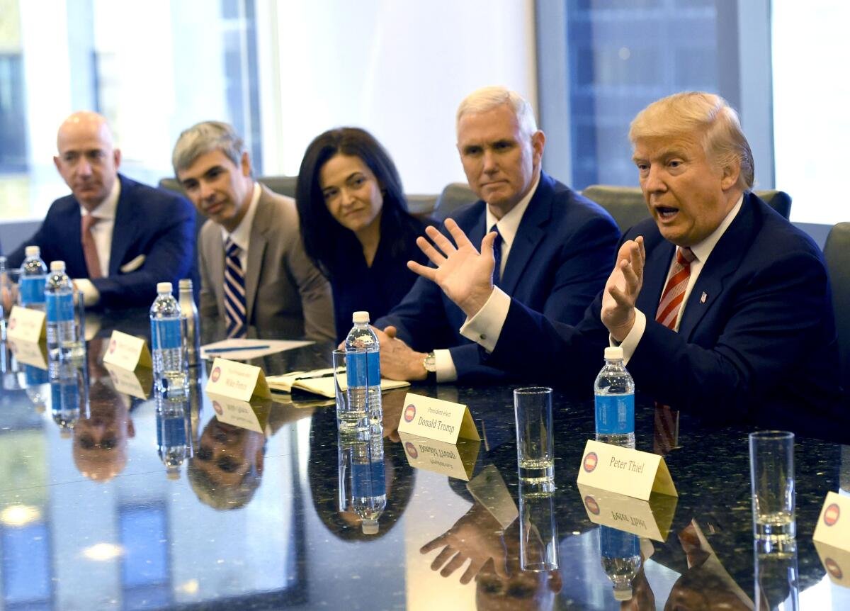 Jeff Bezos, left, Larry Page, Sheryl Sandberg, Mike Pence and Donald Trump at a table.