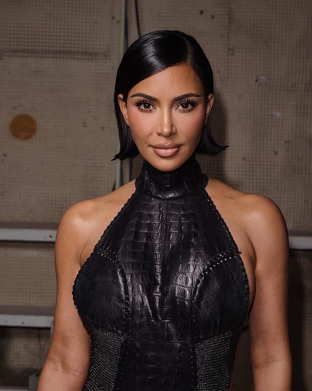 Kim was effortlessly chic in a sleek black leather dress with mesh panels that added a perfect edge