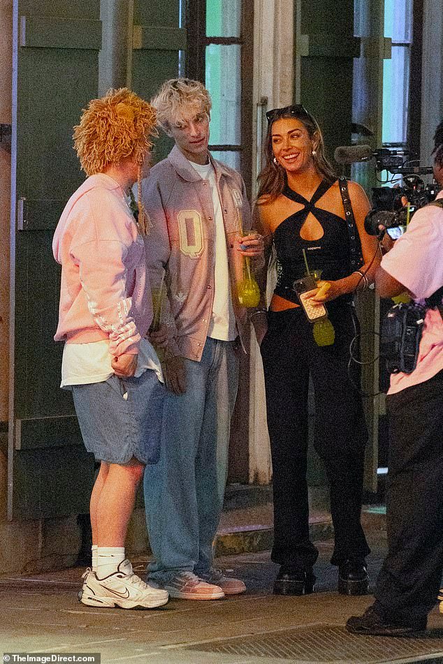 She was accompanied by her BFFs cohost Josh Richards and Twitch streamer Kylie 'Sketch' Cox, as the trio sipped oversized drinks—a Bourbon Street tradition