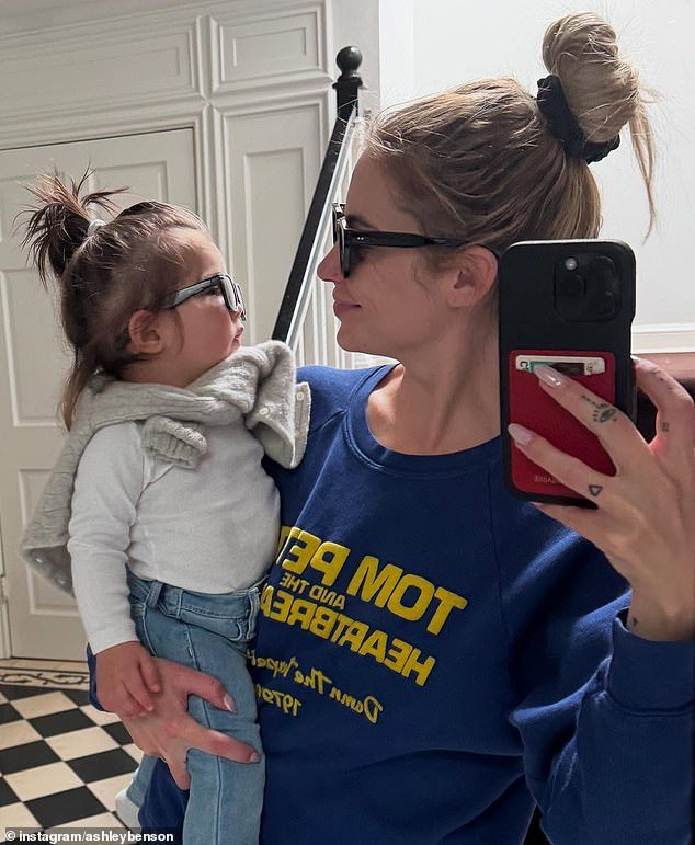 She held her mini-me on her hip in selfies as they matched each other in dark sunglasses