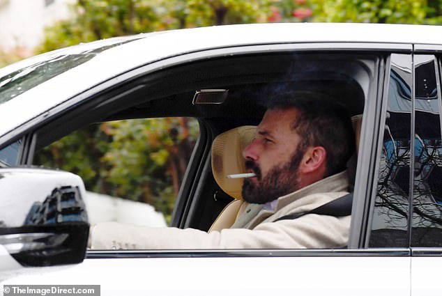 Stressed Ben Affleck puffs on a cigarette after Matt Damon ditches their latest project