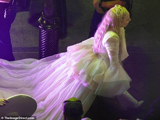 As she walked off the stage, Gaga could be seen wearing a stunning white gown with a long train