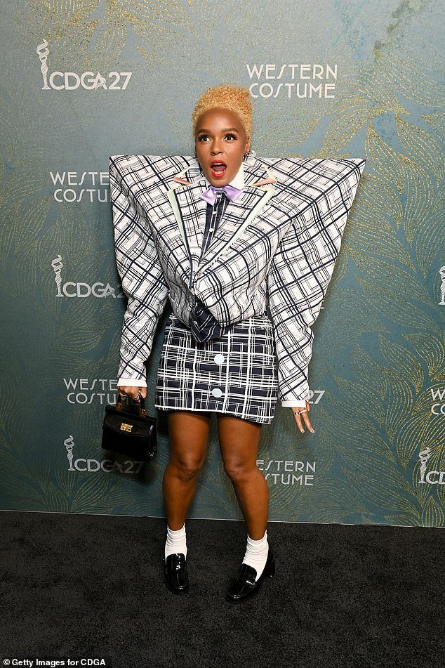 Janelle — who is non-binary and uses she/they pronouns — wore the bizarre jacket over a black button-up dress shirt with a lavender bow tie