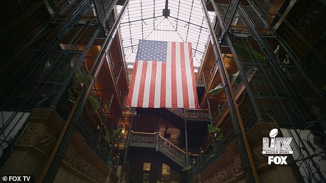 The commercial, shot at the historic Bradbury Building in downtown Los Angeles, ended with the U.S. flag being unfurled