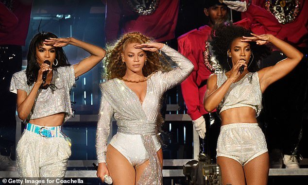 When asked what the Destiny's Child group text was like, she replied that 'it is pure' and 'it¿s friendship,' teasing that one does in fact exist; Michelle, Beyonce and Kelly seen April 2018