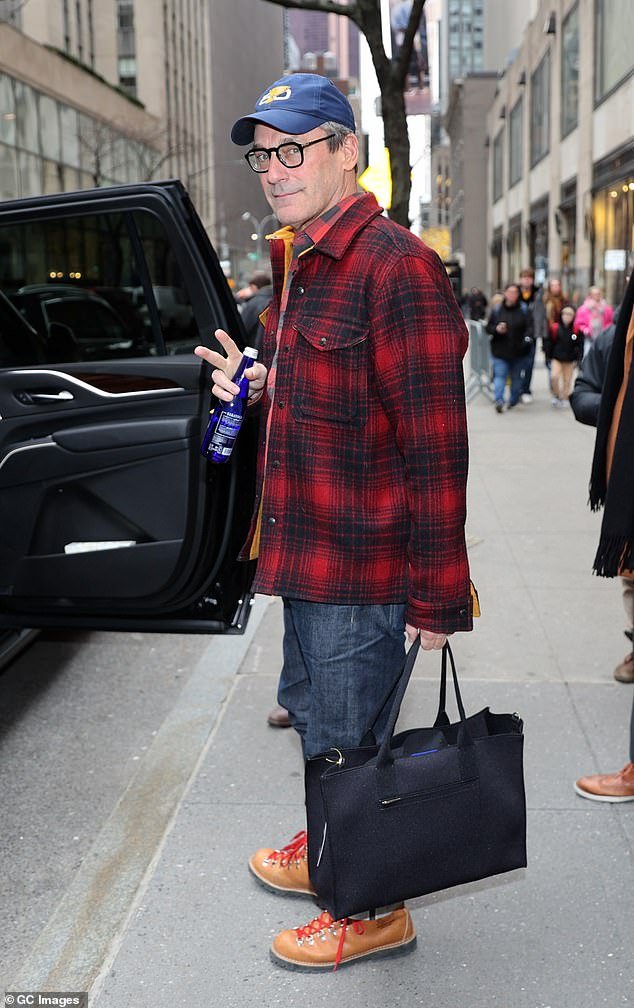 Over the weekend, Jon Hamm was also seen at NBC Studios to preparing for the taping. The 53-year-old Mad Men actor put on a casual display in a red, plaid button-down, which he layered over a red, checkered button-down