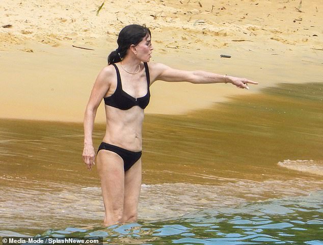 Courteney looked delighted as she frolicked in the sea