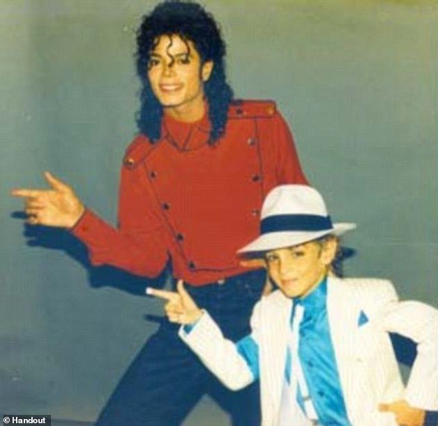 Robson, pictured with Jackson in an undated photo, was five when he met the pop star and went on to appear in three Jackson music videos