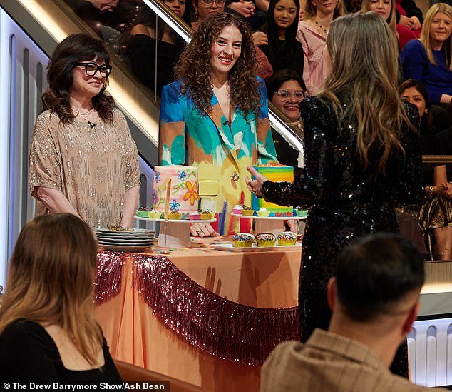 Olive's circular cake had floral designs on the front while Frankie's rainbow cake included a stick-figure picture of her with her mother