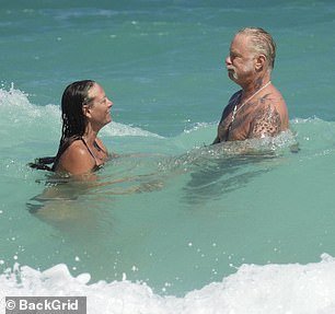 During their vacation, he enjoyed a romance-filled, sun-soaked beach day