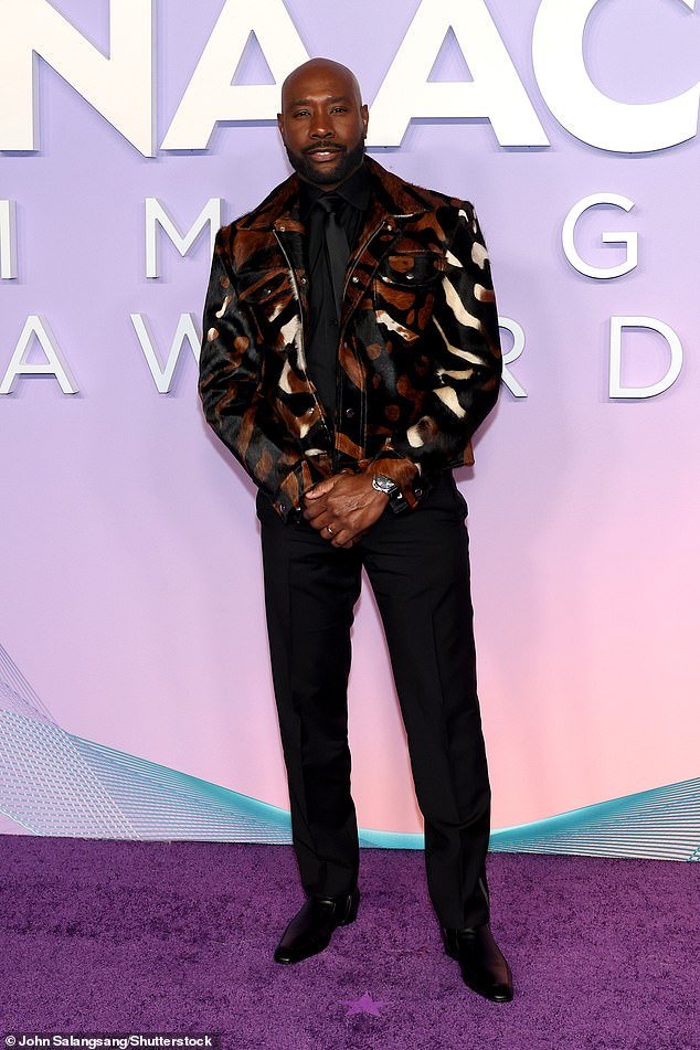 Morris Chestnut showed off his unique style in a black jacket with gold stripes on it