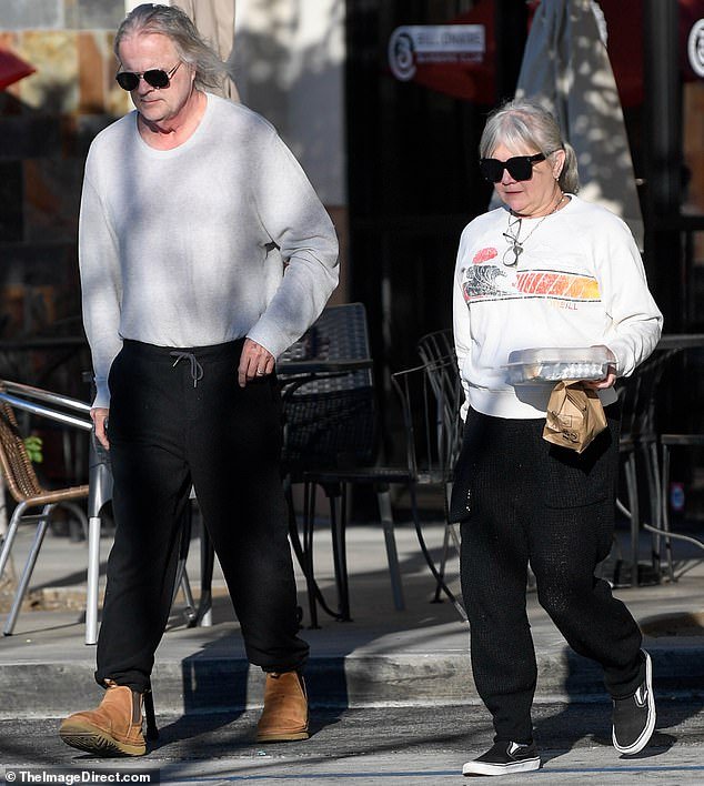 Tracey slipped into a pair of black sneakers and completed the look with black shades to protect her eyes from the bright sunshine