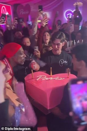 She was about to blow out the birthday candles on her heart-shaped pink cake when Snoop Dogg decided to use the lighter to spark his blunt in a funny Instastory captured by DJ Diplo