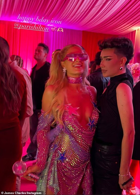 Paris also took a party snap with influencer and Painted make-up mogul, James Charles (R)