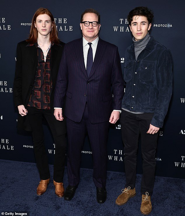 It is Holden Fraser (far right) - the second son of Brendan Fraser and Afton Smith. The former couple welcomed Holden in 2004, and also co-parent sons Griffin, 22, and Leland, 18; Fraser seen above with Leland and Holden in 2022 in NYC