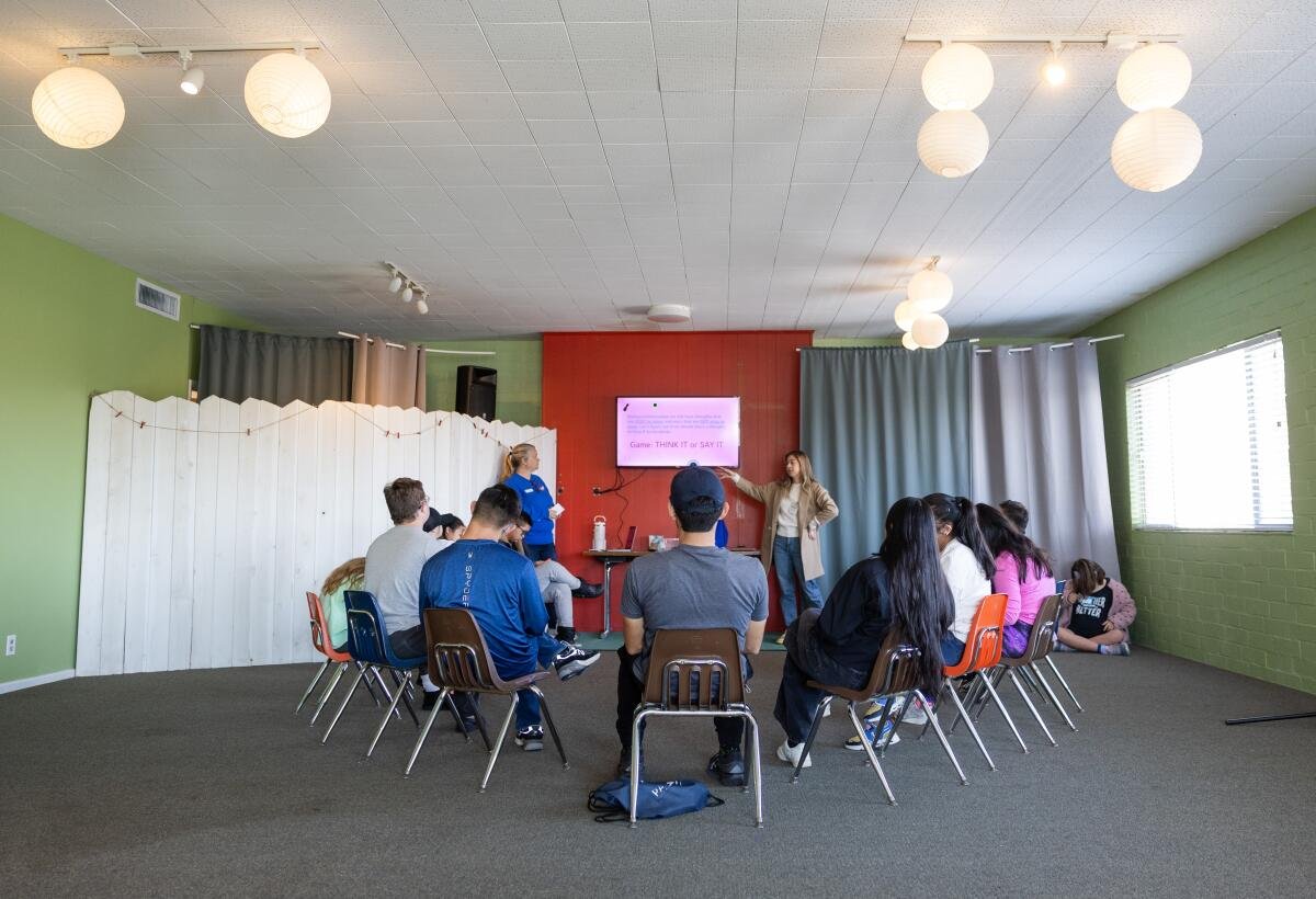 Children with Down syndrome taking a class