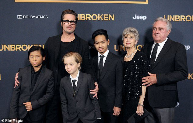 Pitt's parents (right) have not seen the children in eight years, sources have told DailyMail.com (pictured with Brad, Pax, Shiloh and Maddox in 2014)